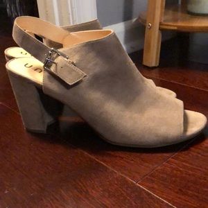 Tan, peep toe strap heeled sandals.